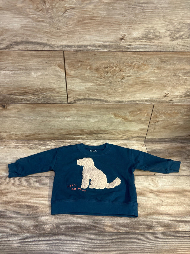 Front view of the blue Just One You dog sweatshirt showcasing a textured dog applique with Lets Go Play text on a wood floor