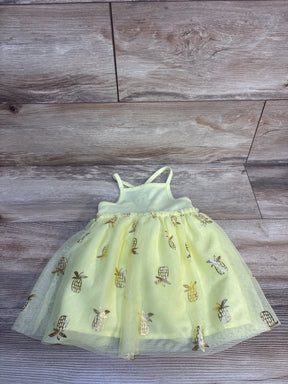 Light green baby dress with gold pineapple print and tulle skirt, perfect for summer outfits.