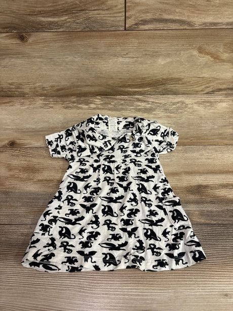 Front view of Kate Quinn bamboo dragon print dress showcasing short sleeves on a wood-grain background