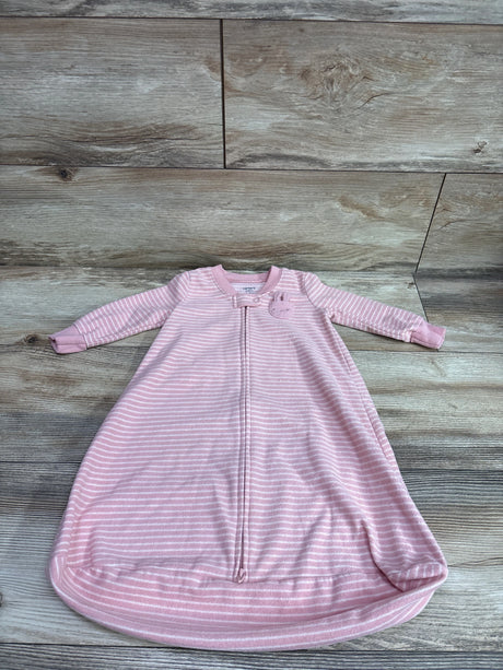 Pink striped Carter's baby blanket sleep sack for size 0-3 months on a wood-grain background