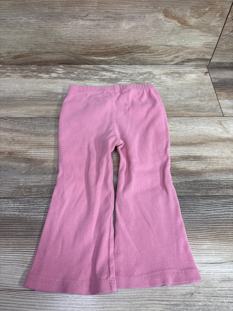 Baby Gap pink ribbed flare leggings for toddlers laid flat on a wooden surface