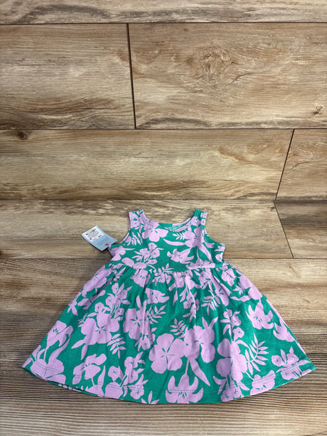 Flat lay of Cat and Jack teal sleeveless floral dress with matching bloomers showing pink flower print on wood floor