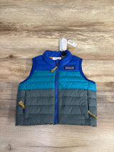 Patagonia kids' sleeveless puffer vest in blue, teal, and gray on wooden surface with zipper and logo