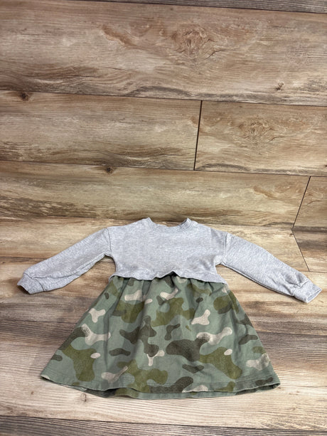 Front view of Carter’s grey sweatshirt dress with camouflage skirt and long sleeves on a wood floor