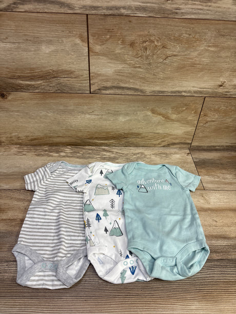 Front view of Cloud Island 3-pack bodysuits showcasing gray stripes, mountain print, and aqua design on a wood floor