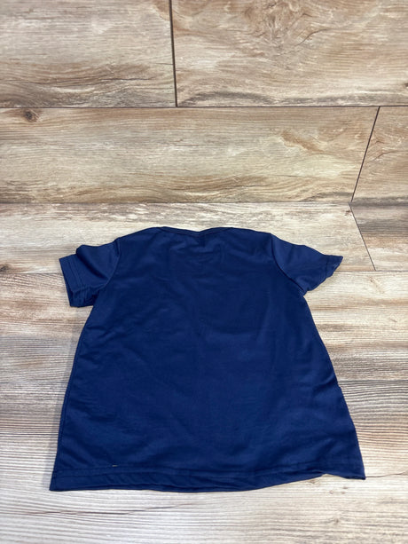 Back view of navy toddler t-shirt (size 4-5T) showing plain back and short sleeves on wood floor background