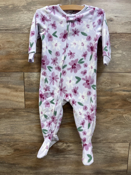 Front view of Carter’s purple blanket sleeper showcasing floral print, zipper, and footed design on a wood background