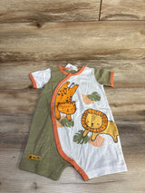 Flat lay of green and white baby shortie romper with orange trim, lion and leopard prints on wood floor background
