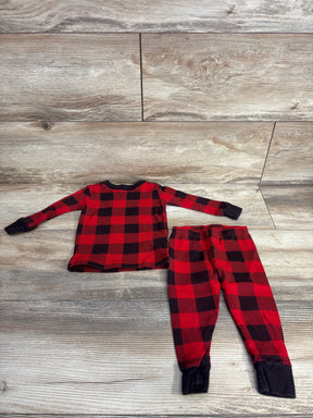 Kids red and black plaid long sleeve pajama set with pants on wooden floor
