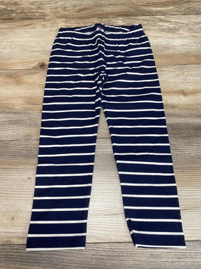 Flat lay of Baby Gap navy and white striped toddler leggings size 3T showing elastic waistband and full-length legs on wood floor background
