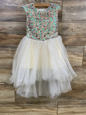 Front view of Halabaloo sequin tulle dress (2T) showing sequin bodice and layered ivory skirt on wood background