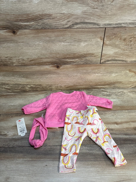 Baby girl outfit with pink quilted sweatshirt, rainbow leggings, and matching headband