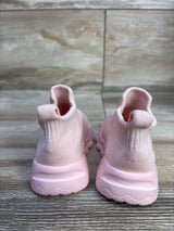 Rear view of pink high-top mesh sock baby shoes showcasing knit sock-style upper and chunky textured sole on wood floor background