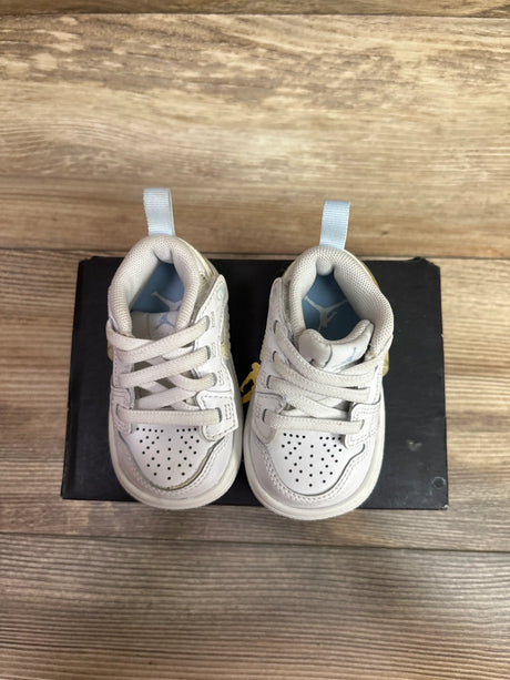 Top view of Air Jordan 4 Retro TD Hyper Violet sneakers showing perforated toe boxes and padded collars on a black box