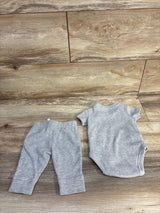 Top-down view of grey Carter's 2-piece waffle knit bodysuit and pants set laid flat showing ribbed texture on wooden floor