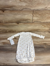 Flat lay of Carter's PurelySoft white infant gown showing tan snail print, long sleeves and elastic gathered bottom on wood surface