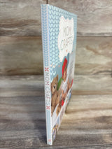 Mom Crafts book with teddy bear and baby images, blue patterned cover on wood surface