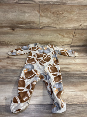 Overhead view of Kids Headquarters football blanket sleeper showcasing zip front, enclosed feet, and football helmet print on wood floor