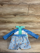 Flat lay of light blue Disney Baby 2-piece Winnie the Pooh rash guard set showing long-sleeve top and striped shorts on wood background