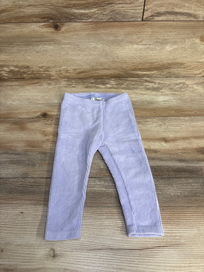 Lavender ribbed toddler leggings laid flat on wood surface, soft baby clothing