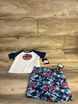 Front view of Hurley toddler 2-piece rashguard set: white shirt with navy sleeves and camo Hurley logo, blue camo shorts with red sharks