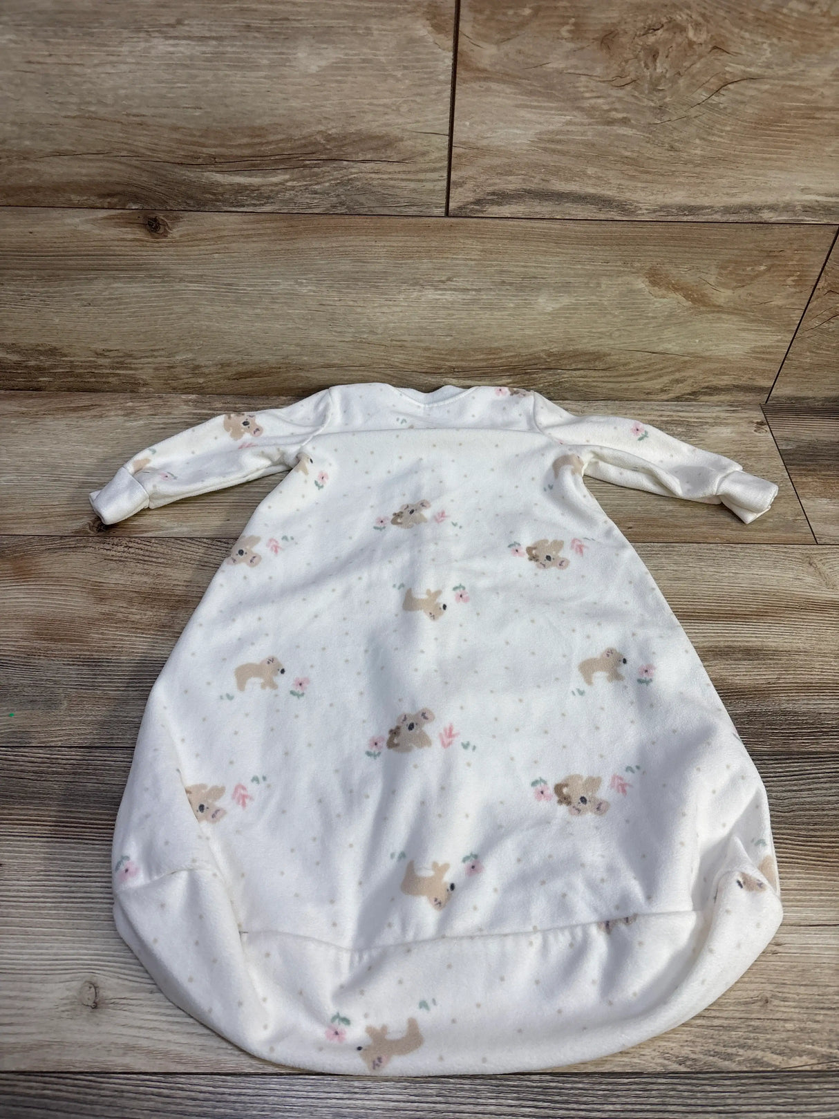 Front view of Carter’s ivory blanket sleep sack, size 0 to 3 months, showcasing long sleeves and bunny print