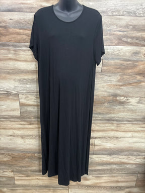 Black maternity maxi dress with short sleeves, displayed on mannequin against wood panel background
