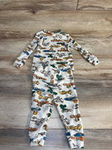 Long sleeve baby pajama set with colorful animal and car print on wood floor