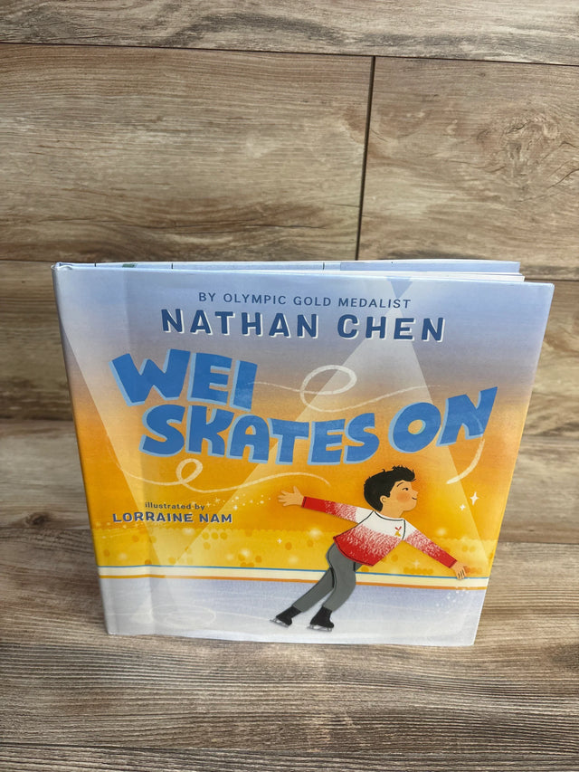 Wei Skates On children's book cover featuring a figure skating boy, wood background