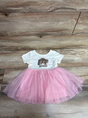 White toddler dress with Barbie logo and diverse girl silhouettes on top, pink tulle skirt
