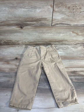Front flat lay of Baby Gap 2T khaki chinos showing slim fit, button waist and belt loops on wood background