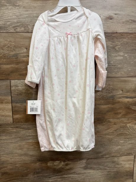 New Little Me 2-pack pink baby sleep gowns size 0-3m hanging on a wooden background.