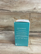 Mason jar baby bottle kit box with French product description against wood background