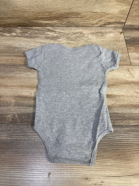 Back view of American Apparel grey baby bodysuit size 3-6m showing short sleeves laid flat on wood background