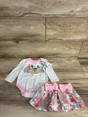 Disney princess baby onesie with floral skirt and pink bows on wood floor