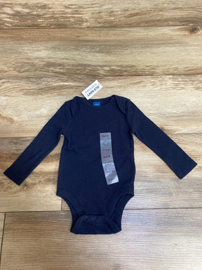 Navy blue ribbed long-sleeve baby bodysuit sized 3-6 months from Old Navy on wooden floor