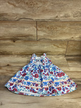 Front view of girls' Btween floral sleeveless dress size 2T with ruffled straps and gathered skirt on wood background