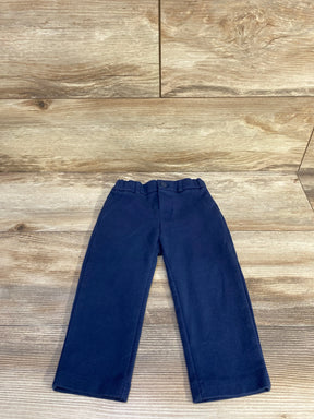 Flat-lay of Mayoral navy toddler dress pants size 12m with elastic waistband, button and straight legs on wood floor