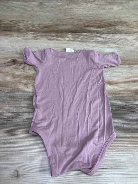 Pink The Woods by Kate Quinn beechwood bodysuit for infants size 6-12m on wooden background