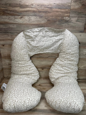 Top-down view of Leachco Back 'N Belly maternity pillow showing U-shape and taupe floral cover on wood floor