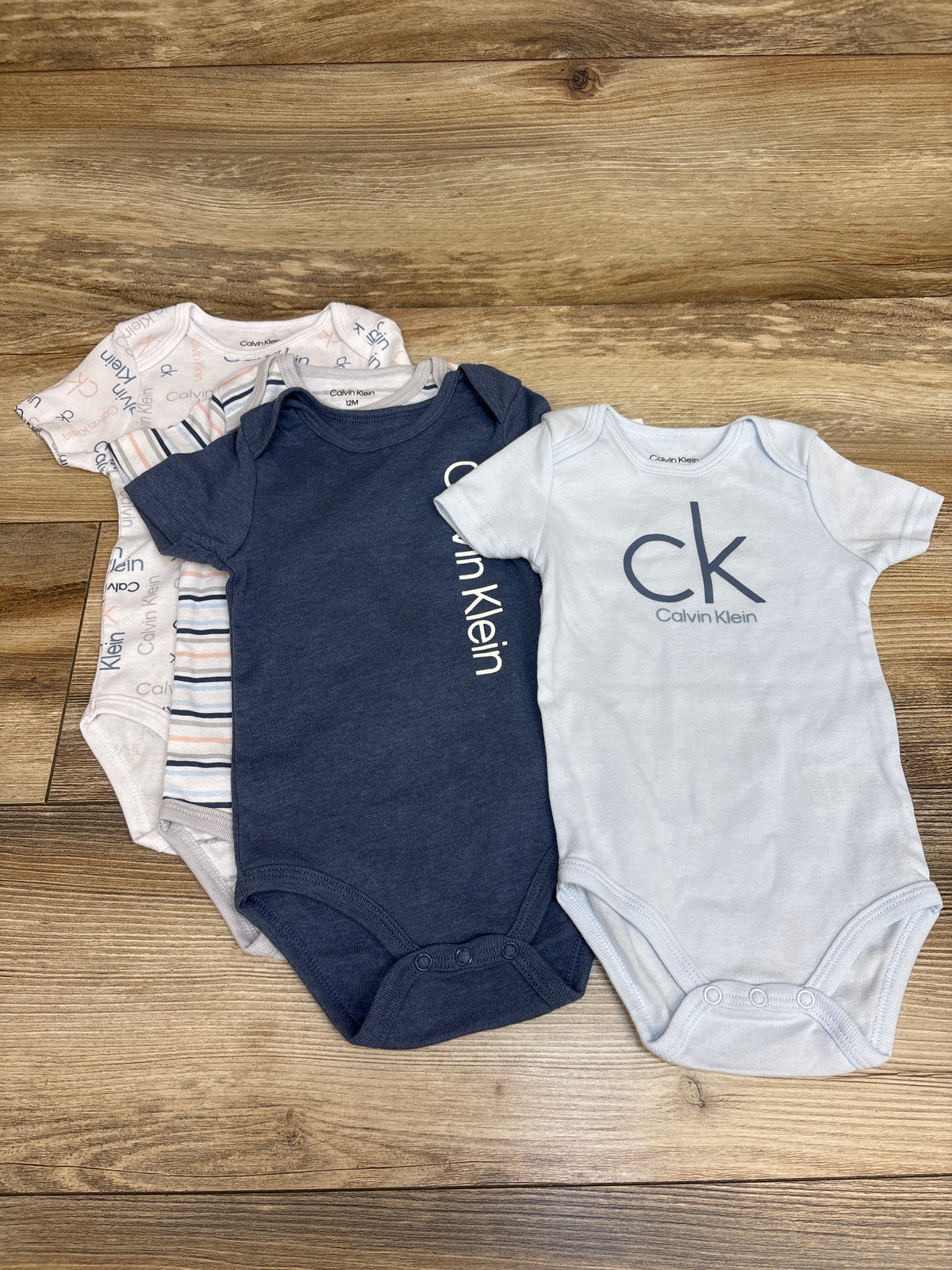 NEW Calvin Klein 4pk Bodysuits Blue sz 12m