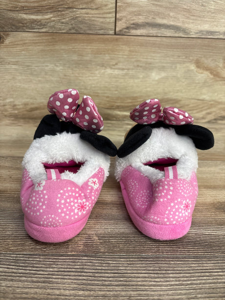 Pair of pink toddler slippers with white polka dot bows and black ears, soft fuzzy lining