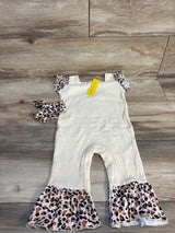 Toddler cream ribbed romper with leopard ruffle sleeves, matching headband on wood floor