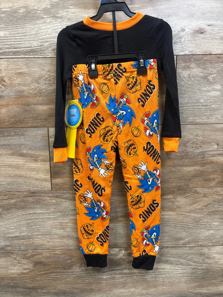 Front view of Sonic the Hedgehog two-piece Halloween pajamas with black top and orange pumpkin-print pants, size 4T