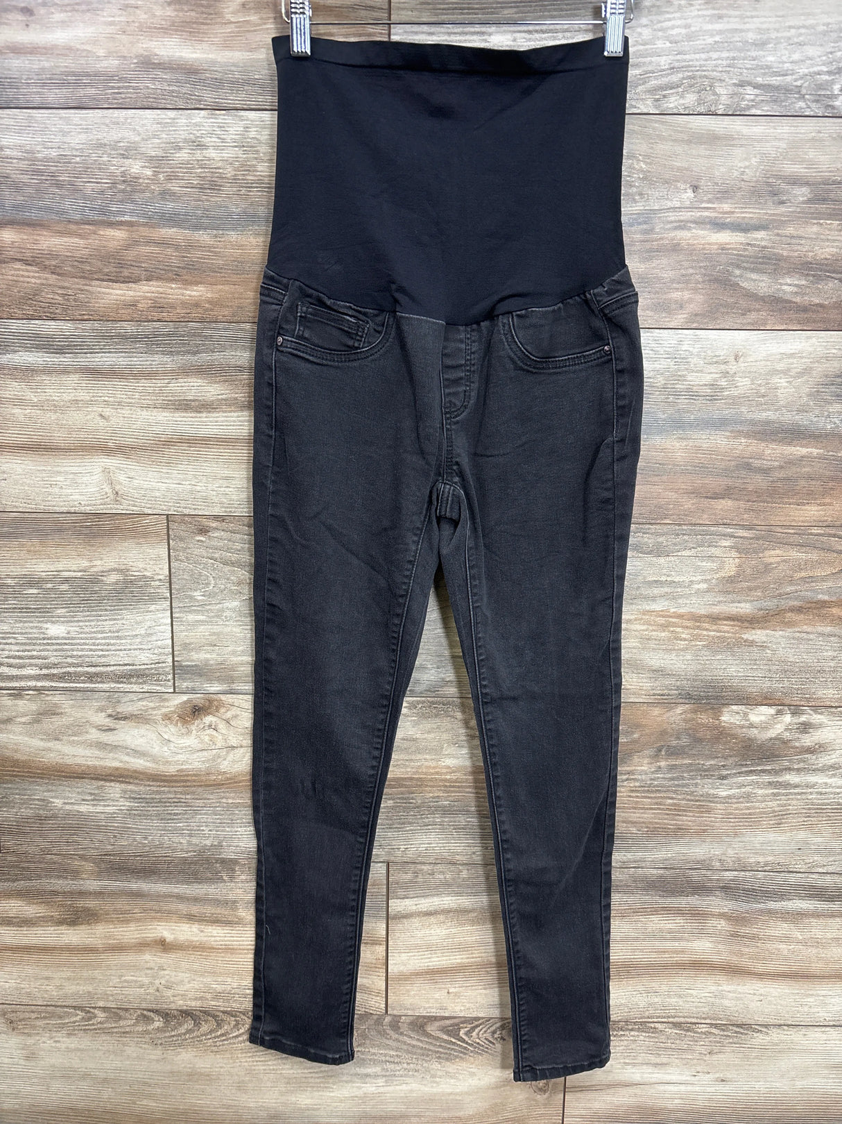 Black maternity jeans with over-the-belly panel, ideal for pregnancy comfort and style
