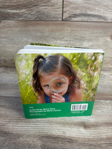 Kids book with girl using magnifying glass, perfect for children's learning and exploration