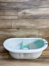 White baby bath tub with mint green sling and support, ideal for infant bathing and baby gear resale