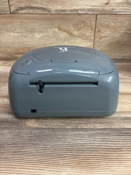 Grey Me n Mommy To Be Hiccapop Ultra Wipe Warmer on a wooden surface.