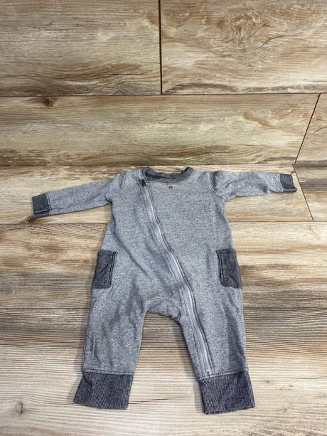 Gray long-sleeve baby romper with dark gray cuffs and pockets, diagonal zipper on wood background
