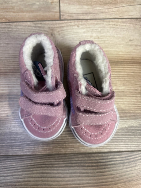 Top view of pink Vans SK8-Mid Reissue V sneakers showcasing hook-and-loop straps and fleece lining on a wood surface